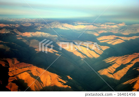 South America Andean Mountains where the summit of the mountain is dyed red with red sunset 16401456