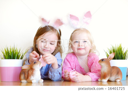 Two sisters wearing bunny ears on Easter 16401725