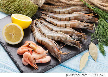Fresh raw tiger prawns and fishing equipment Fresh raw tiger prawns and fishing equipment 16411572