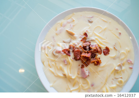 spaghetti carbonara sauce on glass background spaghetti carbonara sauce on glass background 16412037