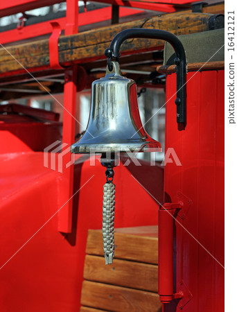 Metal alarm bell on red fire truck Metal alarm bell on red fire truck 16412121