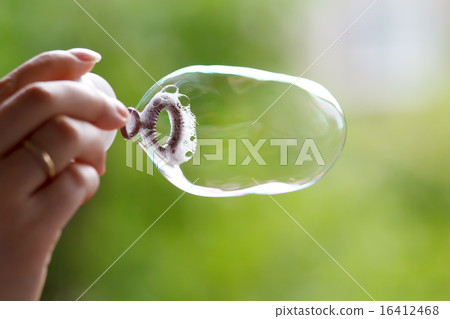 Soap ball in daylight against a background of gree 16412468