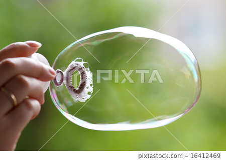 Soap ball in daylight against a background of gree Soap ball in daylight against a background of gree 16412469