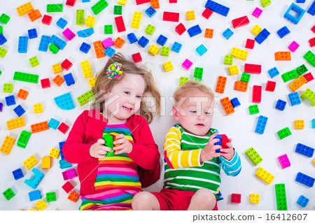 Kids playing with colorful blocks 16412607
