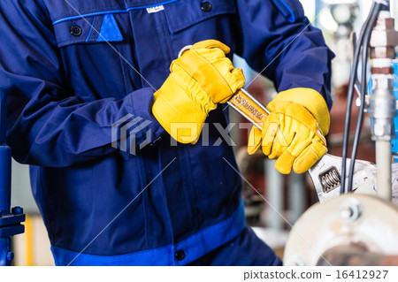 Mechanic repairing machine in industrial plant 16412927