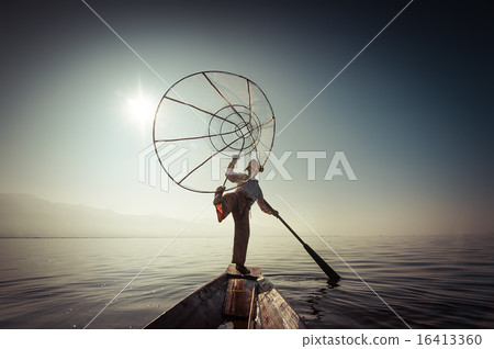 Burmese fisherman catching fish in traditional way Burmese fisherman catching fish in traditional way 16413360
