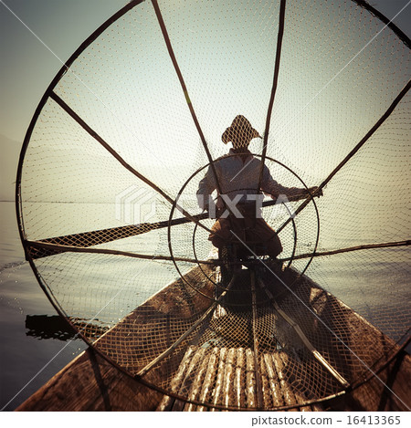 Burmese fisherman catching fish in traditional way Burmese fisherman catching fish in traditional way 16413365
