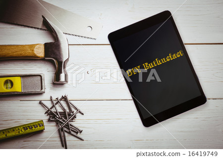 Diy enthusiast against desk with tools Diy enthusiast against desk with tools 16419749