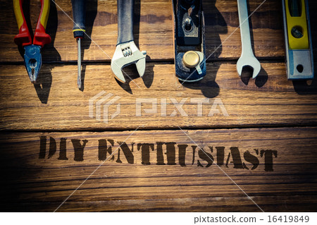 Diy enthusiast against desk with tools Diy enthusiast against desk with tools 16419849