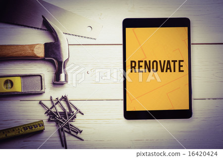 Renovate against tablet displaying blueprint Renovate against tablet displaying blueprint 16420424