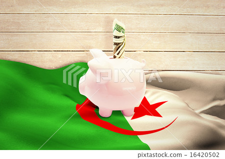 Composite image of dollar in piggy bank Composite image of dollar in piggy bank 16420502