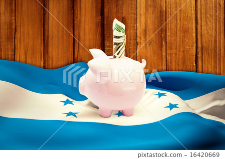 Composite image of dollar in piggy bank Composite image of dollar in piggy bank 16420669