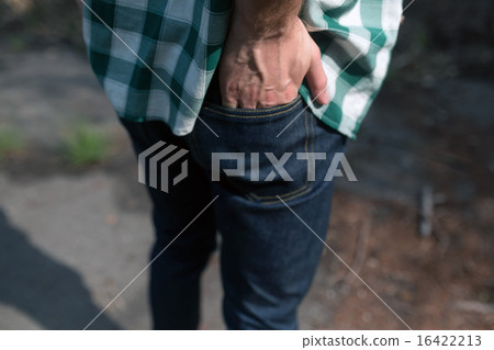 Confident man posing in selvedge jeans Confident man posing in selvedge jeans 16422213