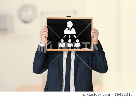 Composite image of businessman holding board 16422313