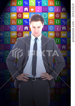 Composite image of serious businessman with hands on hips Composite image of serious businessman with hands on hips 16422828
