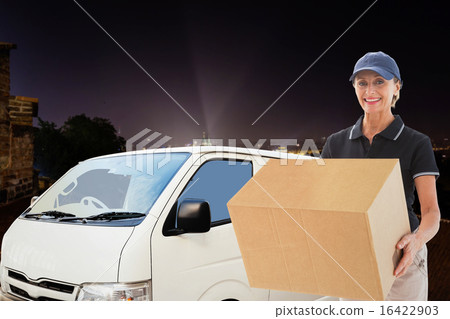 Composite image of happy delivery woman holding cardboard box 16422903