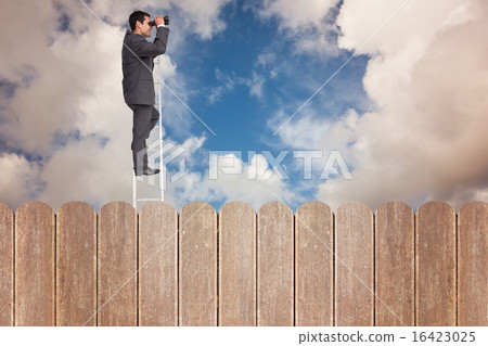 Composite image of businessman standing on ladder using binocula Composite image of businessman standing on ladder using binocula 16423025