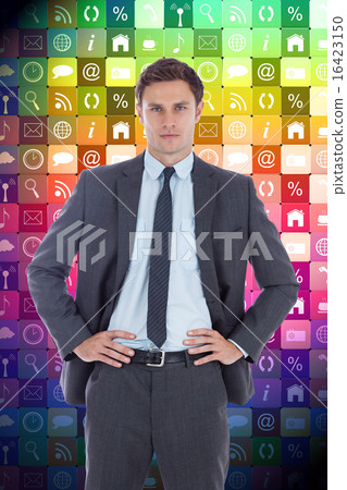 Composite image of serious businessman with hands on hips Composite image of serious businessman with hands on hips 16423150