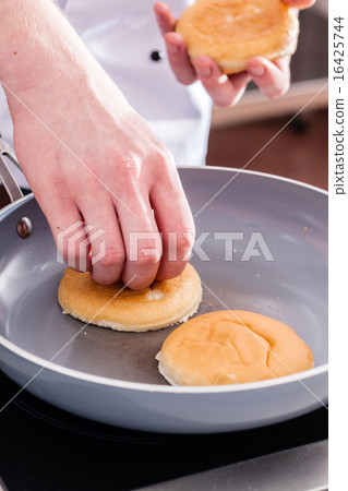 chef making burger chef making burger 16425744