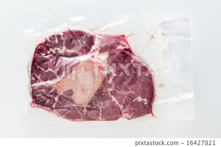 raw steak in vacuum package 16427821