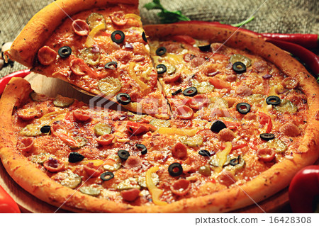 pizza with a slice cut, delicious pastries 16428308
