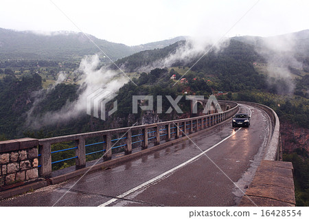 bridge in the mountains fog clouds rain bridge in the mountains fog clouds rain 16428554