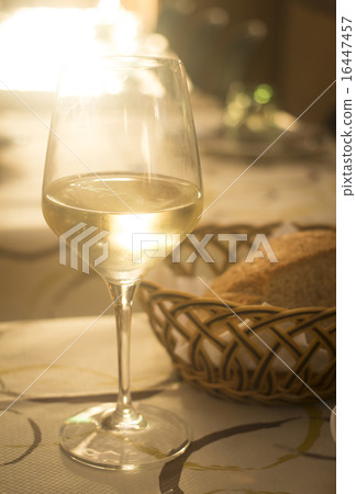 White wine glass and bread in restaurant cafe White wine glass and bread in restaurant cafe 16447457