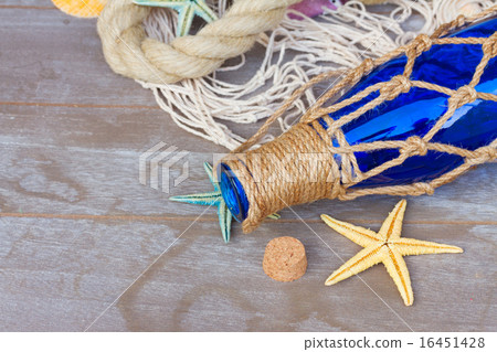compass on fishing net compass on fishing net 16451428