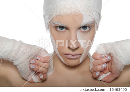 Portrait of woman with white face art and bandage Portrait of woman with white face art and bandage 16463490