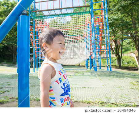 A boy with a smile at the park A boy with a smile at the park 16484046