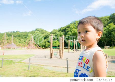 A boy looking far away 16484047