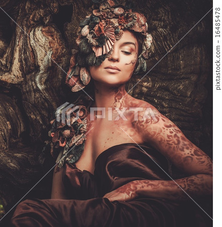 Nymph woman in a magical forest Nymph woman in a magical forest 16485478