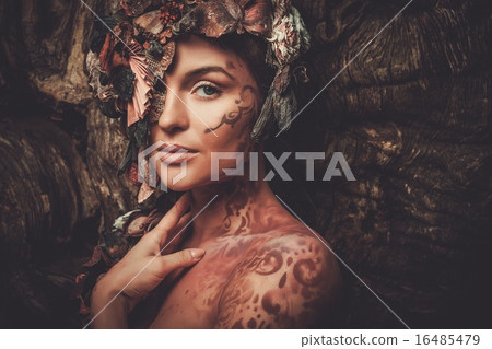 Nymph woman in a magical forest Nymph woman in a magical forest 16485479