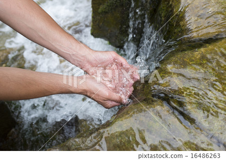 Man's hands with water splash 16486263