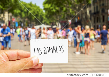 man shows a signboard with the text Las Ramblas man shows a signboard with the text Las Ramblas 16488310