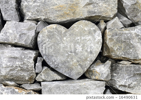 Happy heart shaped stone on the right side of the stone fence in the movie location of Biei town Happy heart shaped stone on the right side of the stone fence in the movie location of Biei town 16490631