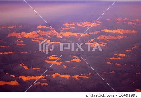 The top of the mountain stained red in the setting sun South America Andes Mountains The top of the mountain stained red in the setting sun South America Andes Mountains 16491993