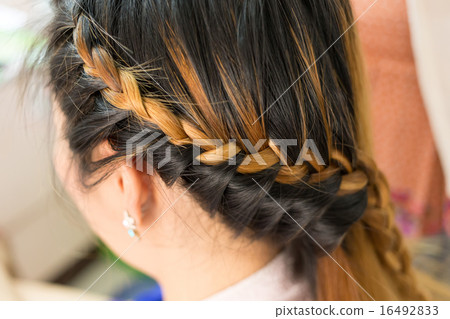 long braid creative brown hair style in salon 16492833