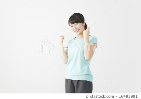 Young woman in fitness wear doing guts pose Young woman in fitness wear doing guts pose 16493991
