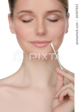 beautiful woman holding cotton swabs at mouth 16497601