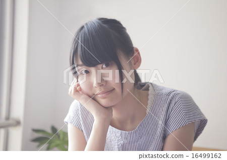 A woman relaxing at a cafe A woman relaxing at a cafe 16499162
