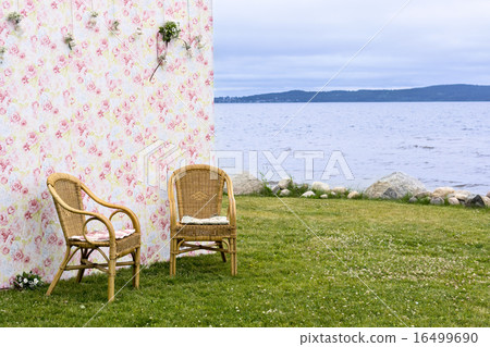 Background and couple of chairs on lakeshore Background and couple of chairs on lakeshore 16499690