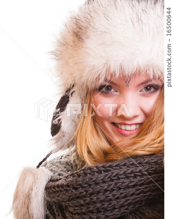 Winter fashion girl in fur hat doing fun isolated 16500644