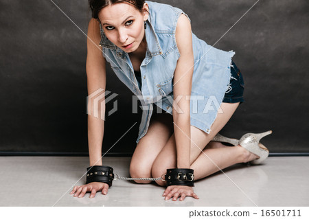 Arrest and jail. Criminal woman prisoner girl in handcuffs Arrest and jail. Criminal woman prisoner girl in handcuffs 16501711
