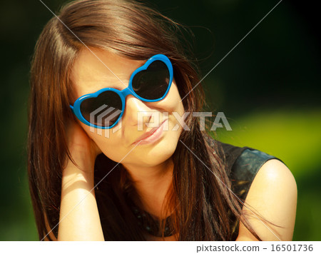 Summer. Portrait of woman in blue sunglasses outdoor 16501736