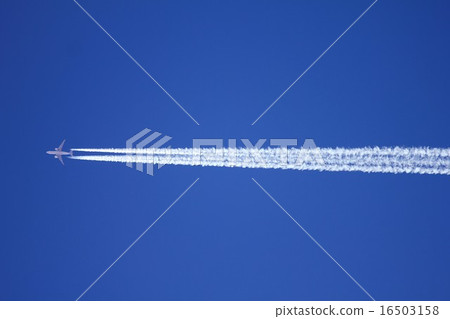 A jet airliner flying while flying a sunny sky with an airplane cloud A jet airliner flying while flying a sunny sky with an airplane cloud 16503158