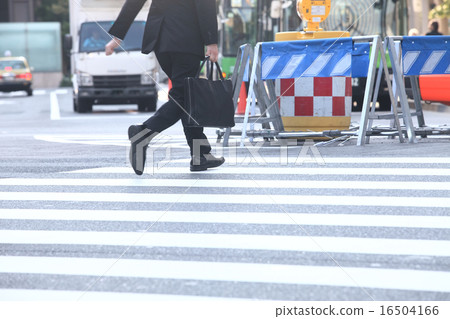 Image of a businessman crossing a pedestrian crossing Image of a businessman crossing a pedestrian crossing 16504166