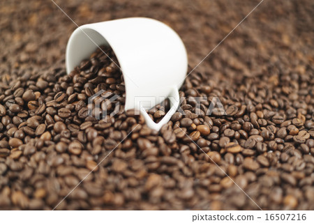 Spilled out of cup coffee beans 16507216