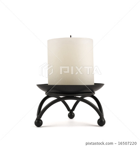 White candle over black metal stand White candle over black metal stand 16507220