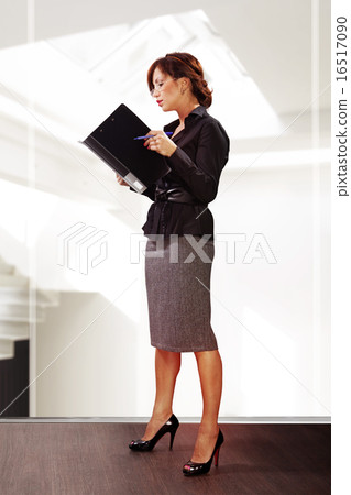 woman reads documents 16517090